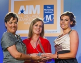 Paula Murphy, Vodafone (sponsor of the Marketing Innovation Award), with award winners Aine Phelan and June Dowling, Bord na Móna Fuels